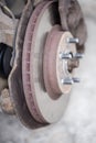 Ventilated  brake disc on used car, closeup in selective focus Royalty Free Stock Photo