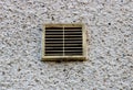 Ventilation Duct Cover on a Roughcast House Rear Wall Royalty Free Stock Photo