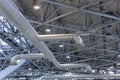 Ventilation in the exhibition pavilion or production plant or hangar or warehouse. Ventilation pipes duct tubes hanging