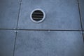 Ventilation hole in the gray panel wall of an industrial building. Royalty Free Stock Photo