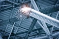 Ventilation pipes in silver insulation material hanging from the ceiling inside new building Royalty Free Stock Photo