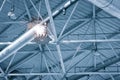 Ventilation pipes in silver insulation material hanging from the ceiling inside new building Royalty Free Stock Photo