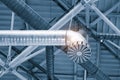 Ventilation pipes in silver insulation material hanging from the ceiling inside new building Royalty Free Stock Photo