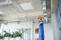 ventilation system installation and repair service. hvac technician at work. banner copy space. Royalty Free Stock Photo
