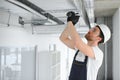 ventilation system installation and repair service. hvac technician at work. banner copy space Royalty Free Stock Photo