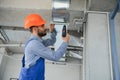 ventilation system installation and repair service. hvac technician at work. banner copy space. Royalty Free Stock Photo