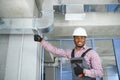 ventilation system installation and repair service. hvac technician at work. banner copy space Royalty Free Stock Photo