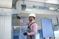 ventilation system installation and repair service. hvac technician at work. banner copy space Royalty Free Stock Photo