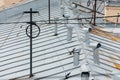 Close up photo of multiple ventilation pipes from stainless steel and antenna with wires on the rooftop of living house. Royalty Free Stock Photo