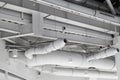 ventilation system under ceiling of modern warehouse or shopping center. Metal piping for air conditioning