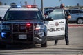 An officer from the City of Ventura Police Department exits his car at a search