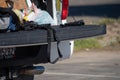 A pistol a magazine and a shotgun sit on the tailgate of a suspects truck during a search of a vehicle by the City of Ventura.