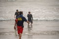 A lifeguard at Ventura Harbor makes contact with swimmers to advise them