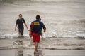 A lifeguard at Ventura Harbor makes contact with swimmers to advise them