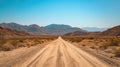 Venture down a remote dirt road, cutting through the barren vastness of the desert landscape. Ai Generated