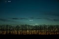 Venus, Mercury and Jupiter on a sunset background with trees. Royalty Free Stock Photo