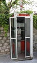 Venzone, UD, Italy - April 22, 2019: old Italian phone booth wit