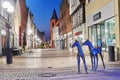 Life size foal sculptures in the pedestrian zone in Verden, Germany at night