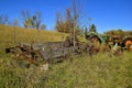 Old John Deere tractors and rotting manure spreader Royalty Free Stock Photo