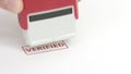 VERIFIED red rubber stamp on the paper Royalty Free Stock Photo