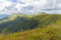 Verkhovyna Watershed Range, Pikui Mountain. Carpathian mountains with grassy slopes and rocks on Pikuy mount. Beautiful mountain l