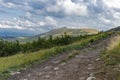 Verkhovyna Watershed Range, Pikui Mountain. Carpathian mountains with grassy slopes and rocks on Pikuy mount. Beautiful mountain l