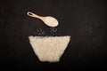 Vermicelli or Chinese rice flour noodles laid out on dark textured background in shape of bowl. Basmati rice in wooden spoon. Top Royalty Free Stock Photo