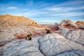 Vermillion Cliffs Photographer following sunrise in the rocks