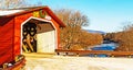 Vermont covered bridge and Winter ice and snow river Royalty Free Stock Photo