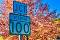 Vermont Road Junction Sign in foliage season Royalty Free Stock Photo