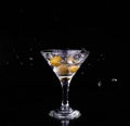 Vermouth cocktail inside martini glass over dark background Royalty Free Stock Photo