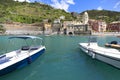 View on bay of water with moored boats, country town Vernazza, Cinque Terre, Italy Royalty Free Stock Photo