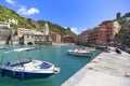 View on bay of water with moored boats, country town Vernazza, Cinque Terre, Italy Royalty Free Stock Photo