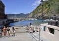 Vernazza, 28th august: Small Port and beach with people panorama of Vernazza village resort from Cinque Terre in Italy