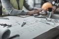 vernier caliper on blueprint in front of Architect working with laptop inspection on the office desk. Engineer, Architect, Royalty Free Stock Photo