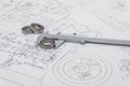 Vernier caliper lying on mechanical scheme with bearings.