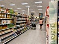 Vero Beach,FL/USA-10/28/19: A disabled senior citizen shopping in the beverage aisle of grocery store with cans and bottles of Royalty Free Stock Photo