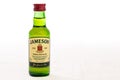 A small Bottle of Irish Whisky on a white background.