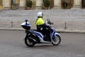 Italian local police officier driving a moped. Royalty Free Stock Photo