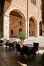 VERONA, ITALY - AUGUST 17, 2017: Restaurant under the arches of the inner courtyard of the castle.