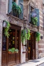 Storefront with green flowers, Verona street, Italy