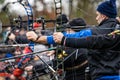 Close-up of a Group of Archers Aiming with Hunting Compound Bows Royalty Free Stock Photo