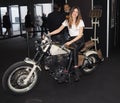 Verona, Italy - january 20, 2018: motor bike expo, a young hostess posing on motorbike. Verona, Veneto, Italy