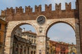 Medieval gate with clock, Verona historic town, Italy