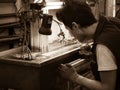 Worker performs hydropneumatic testing of a welded kettle Royalty Free Stock Photo