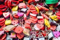 Verona, Italy - June 2022: background of heart-shaped locks on a wall, symbol of love forever