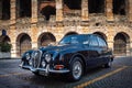 Verona, Italy Ã¢â¬â March 2019.Clasic, 1962 Jaguar Mk II | Hagerty in front of Arena di Verona an Ancient roman amphitheatre in Royalty Free Stock Photo