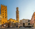 VERONA, ITALY, MARCH 19, 2016: people are strolling through piazza die signori dominated by torre die lamberti in the