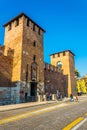 VERONA, ITALY, MARCH 19, 2016: People are strolling on a square in front of the castelvecchio in the italian city Verona Royalty Free Stock Photo