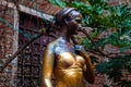 Verona, Italy Ã¢â¬â March 2019. Statue of Juliet in garden of Gothic-style 1300s house and museum, with a stone balcony, said to Royalty Free Stock Photo